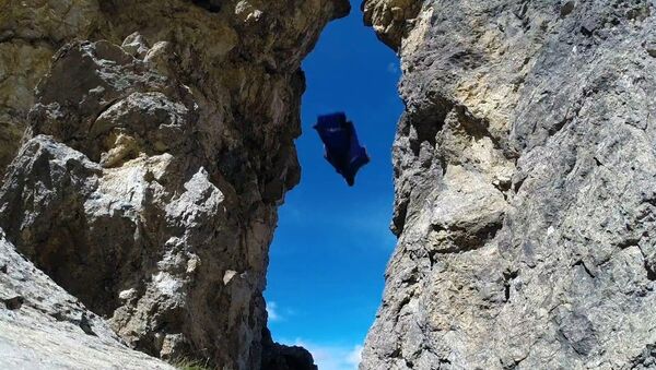 GoPro: Wingsuit Flight Through 2 Meter Cave - Uli Emanuele - Sputnik International
