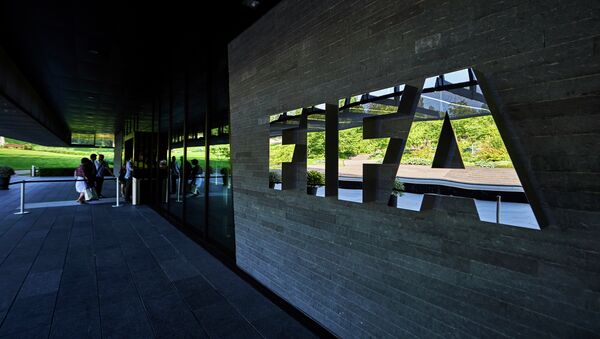 This file photo taken on June 3, 2015 shows FIFA employees entering the FIFA headquarters in Zurich - Sputnik International