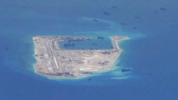 Chinese dredging vessels are purportedly seen in the waters around Fiery Cross Reef. - Sputnik International