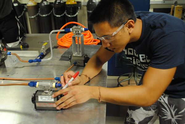 Student from the UCSD chapter of SEDS works on the 3D-printed engine rocket project. Student from the UCSD chapter of SEDS works on the 3D-printed engine rocket project. - Sputnik International