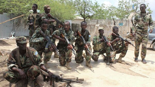 Somali government soldiers pose after they captured Belidogle airport, Somalia, with some help from African Union troops, in 2012. - Sputnik International