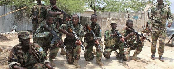 Somali government soldiers pose after they captured Belidogle airport, Somalia, with some help from African Union troops, in 2012. - Sputnik International
