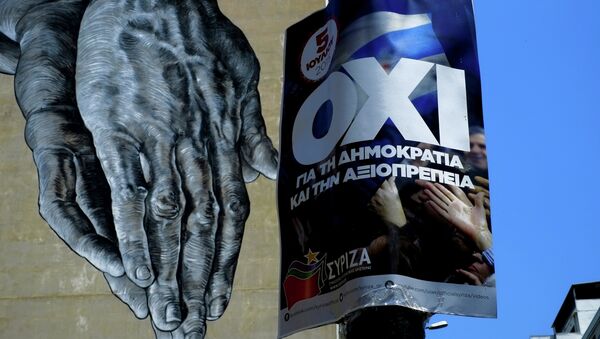 Hands painted on the wall of a building seen behind a poster for a NO vote in the upcoming referendum, in central Athens, Wednesday, July 1, 2015. - Sputnik International