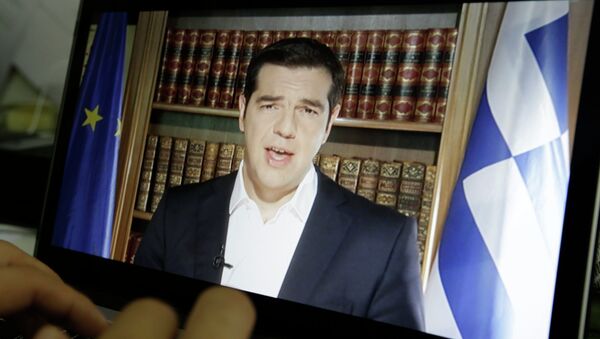 An Associated Press TV producer edits the video of Greece's Prime Minister Alexis Tsipras televised address to the nation in Athens, Friday, July 3, 2015 - Sputnik International