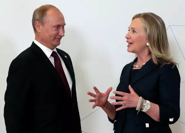 Russian President Vladimir Putin, left, meets U.S. Secretary of State Hillary Rodham Clinton on her arrival at the APEC summit in Vladivostok, Russia, Saturday, Sept. 8, 2012. Russian President Vladimir Putin, left, meets U.S. Secretary of State Hillary Rodham Clinton on her arrival at the APEC summit in Vladivostok, Russia, Saturday, Sept. 8, 2012. - Sputnik International