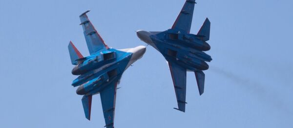 Russian Vikings aerobatics team performing on board SU-27 planes at the opening ceremony of the Fifteenth International Maritime Defense Show in St.Petersburg. Russian Vikings aerobatics team performing on board SU-27 planes at the opening ceremony of the Fifteenth International Maritime Defense Show in St.Petersburg. - Sputnik International