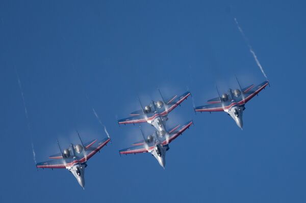 Russian Vikings aerobatics team performing on board SU-27 planes at the opening ceremony of the Fifteenth International Maritime Defense Show in St.Petersburg. - Sputnik International
