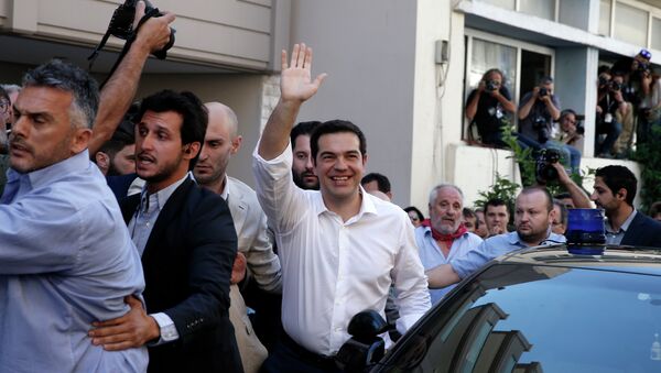 Greece's Prime Minister Alexis Tsipras waves to his supporters after voting outside a polling station in Athens, Sunday, July 5, 2015 - Sputnik International
