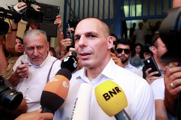 Greek Finance Minister Yanis Varoufakis is surrounded by media as he leaves a polling station during a referendum in Athens, Greece July 5, 2015 Greek Finance Minister Yanis Varoufakis is surrounded by media as he leaves a polling station during a referendum in Athens, Greece July 5, 2015 - Sputnik International