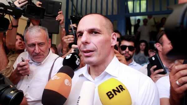 Greek Finance Minister Yanis Varoufakis is surrounded by media as he leaves a polling station during a referendum in Athens, Greece July 5, 2015 - Sputnik International