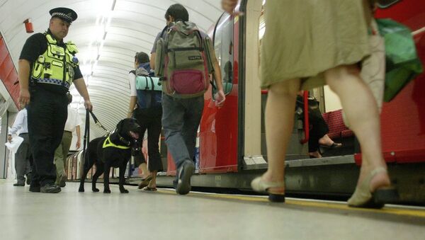 Counter Terrorism Police Dog, officer Vinni, sniffs for explosives as he patrols Liverpool Street underground platform as passengers alight from a tube train, Wednesday July 20, 2005, as security is stepped up at Liverpool Street Tube Station in London. - Sputnik International