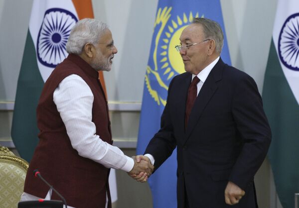 Kazakh President Nursultan Nazarbayev (R) shakes hands with Indian Prime Minister Narendra Modi during a meeting in Astana, Kazakhstan, July 8, 2015. Kazakh President Nursultan Nazarbayev (R) shakes hands with Indian Prime Minister Narendra Modi during a meeting in Astana, Kazakhstan, July 8, 2015. - Sputnik International