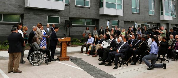 Housing and Urban Development Secretary Julian Castro announces a policy change at a news conference Wednesday, July 8, 2015, in Chicago next to new public housing units on the city's South Side Housing and Urban Development Secretary Julian Castro announces a policy change at a news conference Wednesday, July 8, 2015, in Chicago next to new public housing units on the city's South Side - Sputnik International