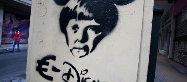In this photo made on Thursday, June 18, 2015 a man walks behind a stencil depicting German Chancellor Angela Merkel as a Disney character in Athens In this photo made on Thursday, June 18, 2015 a man walks behind a stencil depicting German Chancellor Angela Merkel as a Disney character in Athens - Sputnik International