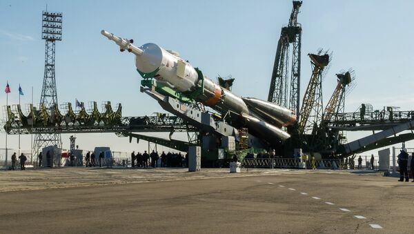 Installation of the rocket of space appointment (RSA) Soyuz-FG with the transport piloted ship Soyuz TMA-16M on a starting complex of the Baikonur spaceport - Sputnik International