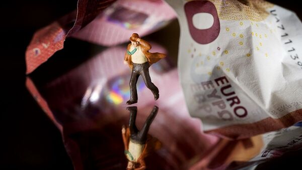 This illustration picture taken in Paris on July 7, 2015 shows a plastic figurine set in the motion of running from underneath a 10 Euro note. - Sputnik International