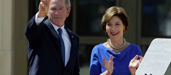 Former President George W. Bush, accompanied by his wife former first lady Laura Bush, flashes the W sign after his speech during the dedication of the George W. Bush Presidential Center Former President George W. Bush, accompanied by his wife former first lady Laura Bush, flashes the W sign after his speech during the dedication of the George W. Bush Presidential Center - Sputnik International