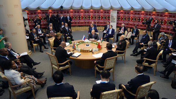 Brazil's President Dilma Rousseff, South Africa's President Jacob Zuma, Russia's President Vladimir Putin, Chinese President Xi Jinping and Indian Prime Minister Narendra Modi sit around the table during a working session at the 7th BRICS summit in Ufa on July 9, 2015 - Sputnik International