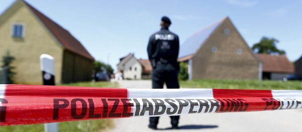 A police tape and a German police officer are seen in Tiefenthal near Ansbach, Germany, July 10, 2015 A police tape and a German police officer are seen in Tiefenthal near Ansbach, Germany, July 10, 2015 - Sputnik International