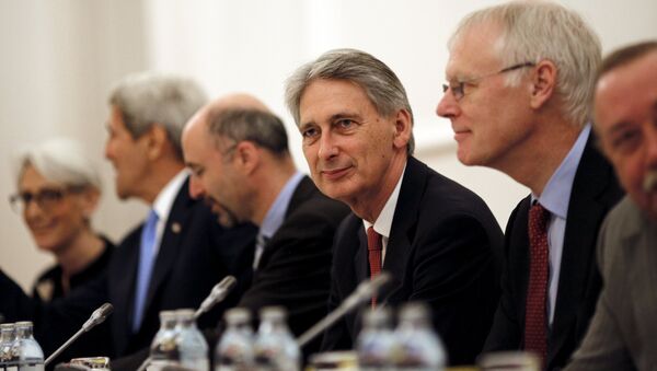 British Foreign Secretary Philip Hammond (C) attends a meeting with foreign ministers and representatives of United States, France, Germany, China, Russia and the European Union during nuclear talks at a hotel in Vienna, Austria July 10, 2015 - Sputnik International