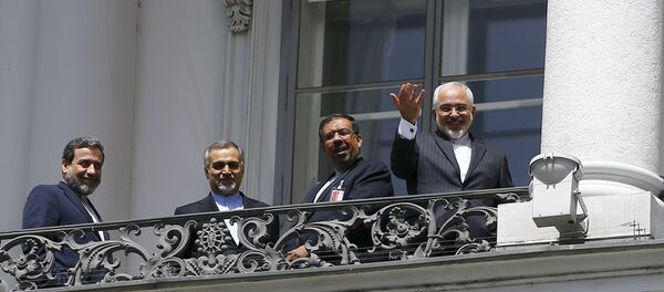 Iranian Foreign Minister Javad Zarif (R) listens to questions from journalists as he stands next to Iran's chief nuclear negotiator Abbas Araghchi (L) and Hossein Fereydoon (2nd L), brother and close aide to President Hassan Rouhani, on the balcony of Palais Coburg, the venue for nuclear talks in Vienna, Austria, July 10, 2015 Iranian Foreign Minister Javad Zarif (R) listens to questions from journalists as he stands next to Iran's chief nuclear negotiator Abbas Araghchi (L) and Hossein Fereydoon (2nd L), brother and close aide to President Hassan Rouhani, on the balcony of Palais Coburg, the venue for nuclear talks in Vienna, Austria, July 10, 2015 - Sputnik International