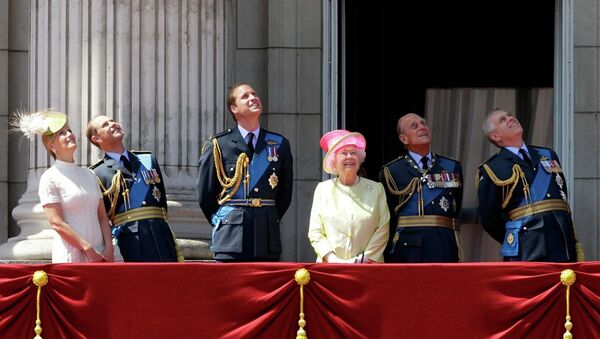 Britain's Queen Elizabeth II, fourth left, and from left, Sophie Countess of Wessex, Prince Edward, Prince William, her husband Prince Philip, and Prince Andrew watch a Royal Air Force flypast to mark the 75th anniversary of the Battle of Britain from a balcony at Buckingham Palace, in London, Friday, July 10, 2015. - Sputnik International