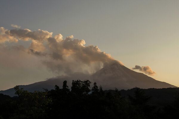 Smoke and ash rise from the Colima volcano, also known as the Volcano of Fire, near the town of Comala, Mexico, Friday, July 10, 2015 Smoke and ash rise from the Colima volcano, also known as the Volcano of Fire, near the town of Comala, Mexico, Friday, July 10, 2015 - Sputnik International