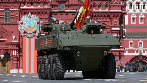 Bumerang armored personnel carrier drives during the Victory Parade marking the 70th anniversary of the defeat of the Nazis in World War II, in Red Square in Moscow, Russia, Saturday, May 9, 2015 - Sputnik International