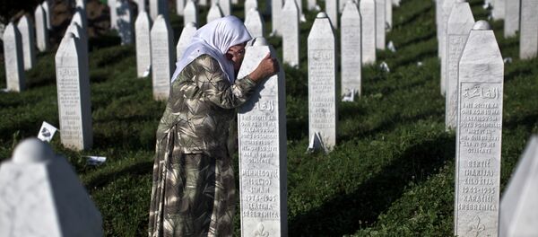 A woman weeps as she visits the grave of a family member at the Potocari memorial complex near Srebrenica, 150 kilometers (94 miles) northeast of Sarajevo, Bosnia and Herzegovina, Saturday, July 11, 2015 A woman weeps as she visits the grave of a family member at the Potocari memorial complex near Srebrenica, 150 kilometers (94 miles) northeast of Sarajevo, Bosnia and Herzegovina, Saturday, July 11, 2015 - Sputnik International