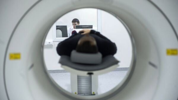 A technician performs an MRI scan. File photo - Sputnik International