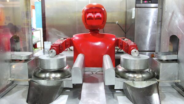 A robot cooks in a robot-themed restaurant in Harbin, northeast China's Heilongjiang province on January 16, 2013 - Sputnik International