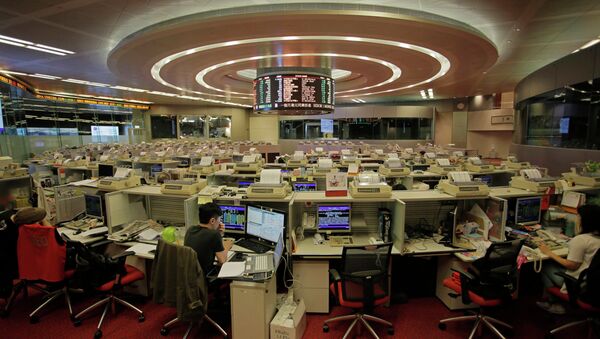 In this June 10, 2015 photo, traders work at Hong Kong's Stock Exchange in Hong Kong - Sputnik International