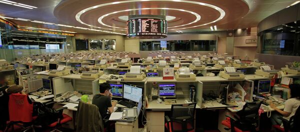In this June 10, 2015 photo, traders work at Hong Kong's Stock Exchange in Hong Kong In this June 10, 2015 photo, traders work at Hong Kong's Stock Exchange in Hong Kong - Sputnik International