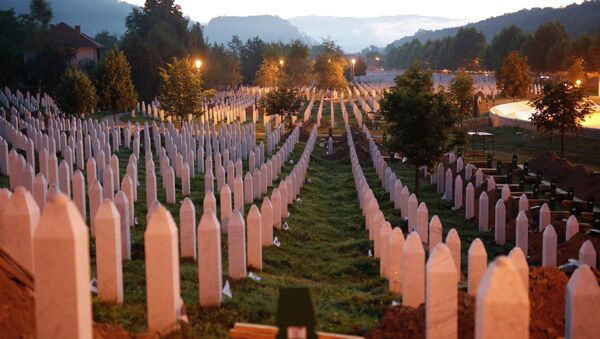 Gravestones are seen at sunrise at a memorial complex near Srebrenica, 150 kilometers (94 miles) northeast of Sarajevo, Bosnia and Herzegovina, Saturday, July 11, 2015 - Sputnik International