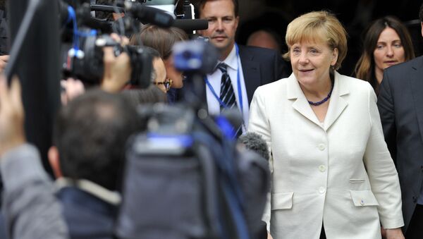 German Chancellor Angela Merkel (R) arrives for a meeting of European Popular Parties (EPP), on July 12, 2015, in Brussels - Sputnik International