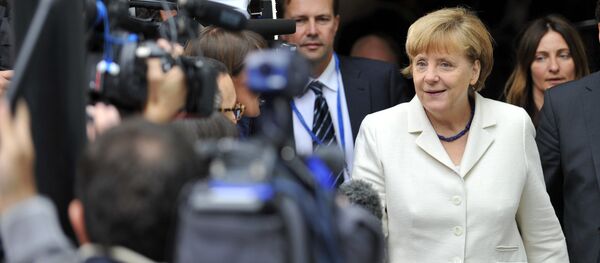German Chancellor Angela Merkel (R) arrives for a meeting of European Popular Parties (EPP), on July 12, 2015, in Brussels German Chancellor Angela Merkel (R) arrives for a meeting of European Popular Parties (EPP), on July 12, 2015, in Brussels - Sputnik International