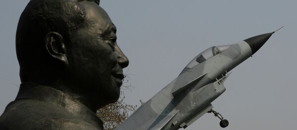 A statue of Wu Daguan who is known as the 'Father of China's military and civilian aviation industry' beside a Chinese produced J-10 fighter jet in Beijing A statue of Wu Daguan who is known as the 'Father of China's military and civilian aviation industry' beside a Chinese produced J-10 fighter jet in Beijing - Sputnik International