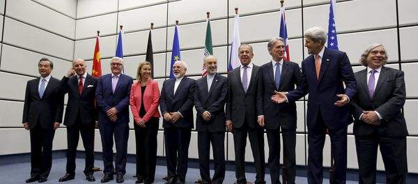 (From L to R) Chinese Foreign Minister Wang Yi, French Foreign Minister Laurent Fabius, German Foreign Minister Frank Walter Steinmeier, European Union High Representative for Foreign Affairs and Security Policy Federica Mogherini, Iranian Foreign Minister Mohammad Javad Zarif, Head of the Iranian Atomic Energy Organization Ali Akbar Salehi, Russian Foreign Minister Sergey Lavrov, British Foreign Secretary Philip Hammon, U.S. Secretary of State John Kerry and U.S. Secretary of Energy Ernest Moniz pose for a group picture at the United Nations building in Vienna, Austria July 14, 2015 (From L to R) Chinese Foreign Minister Wang Yi, French Foreign Minister Laurent Fabius, German Foreign Minister Frank Walter Steinmeier, European Union High Representative for Foreign Affairs and Security Policy Federica Mogherini, Iranian Foreign Minister Mohammad Javad Zarif, Head of the Iranian Atomic Energy Organization Ali Akbar Salehi, Russian Foreign Minister Sergey Lavrov, British Foreign Secretary Philip Hammon, U.S. Secretary of State John Kerry and U.S. Secretary of Energy Ernest Moniz pose for a group picture at the United Nations building in Vienna, Austria July 14, 2015 - Sputnik International