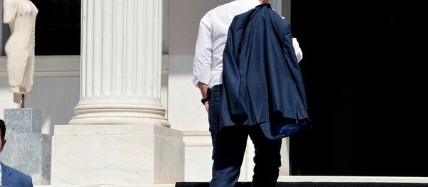 Greek Prime Minister Alexis Tsipras arrives at his office in Athens just after flying in from Brussels on July 13, 2015. - Sputnik International