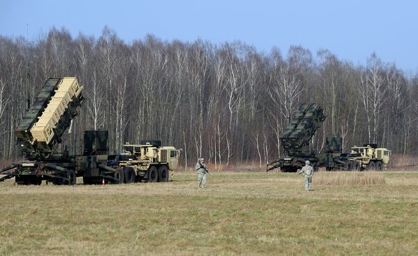 US troops from the 5th Battalion of the 7th Air Defense Regiment emplace a launching station of the Patriot air and missile defence system at a test range in Sochaczew, Poland.file photo US troops from the 5th Battalion of the 7th Air Defense Regiment emplace a launching station of the Patriot air and missile defence system at a test range in Sochaczew, Poland.file photo - Sputnik International
