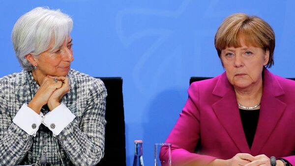 German Chancellor Angela Merkel, right, and Christine Lagarde, Managing Director of the International Monetary Fund - Sputnik International