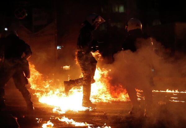 Riot police is on fire as anti-austerity protesters throw petrol bombs during clashes in Athens, Wednesday, July 15, 2015. Riot police is on fire as anti-austerity protesters throw petrol bombs during clashes in Athens, Wednesday, July 15, 2015. - Sputnik International