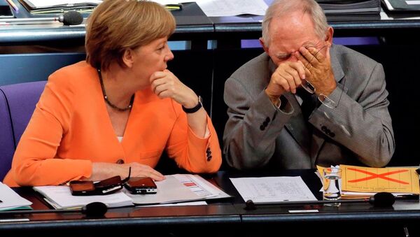 German Chancellor Angela Merkel, left, talks to Finance Minister Wolfgang Schaeuble during a debate on the Greek financial crisis at the German parliament in Berlin, Wednesday, July 1, 2015. - Sputnik International
