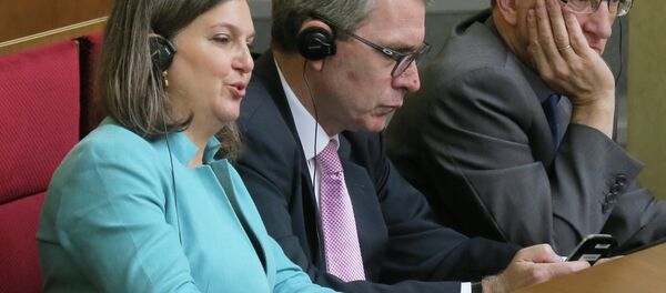 U.S. Assistant Secretary of State Victoria Nuland, foreground, listens, during a parliament session in Kiev, Ukraine Thursday, July 16, 2015 U.S. Assistant Secretary of State Victoria Nuland, foreground, listens, during a parliament session in Kiev, Ukraine Thursday, July 16, 2015 - Sputnik International