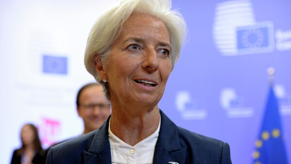 International Monetary Fund's (IMF) Managing Director Christine Lagarde talks to the media at the end of an Eurozone Summit over the Greek debt crisis in Brussels on July 13, 2015 - Sputnik International