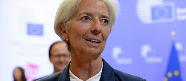 International Monetary Fund's (IMF) Managing Director Christine Lagarde talks to the media at the end of an Eurozone Summit over the Greek debt crisis in Brussels on July 13, 2015 - Sputnik International