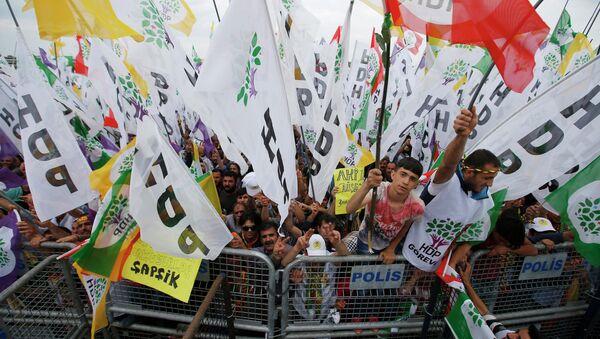 Supporters listen to Selahattin Demirtas, co-chair of the pro-Kurdish Peoples' Democratic Party, HDP, as he addresses an election rally in Istanbul, Turkey, Saturday, May 30, 2015 - Sputnik International