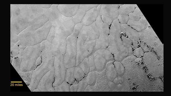 This image from NASA's New Horizons spacecraft shows a new, close-up view of the heart-shaped feature on the surface of Pluto that reveals a vast, craterless plain. This image from NASA's New Horizons spacecraft shows a new, close-up view of the heart-shaped feature on the surface of Pluto that reveals a vast, craterless plain. - Sputnik International