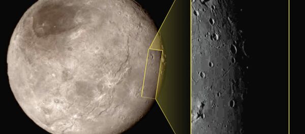 This photo shows Pluto's largest moon Charon, left, with a captivating feature, a depression with a peak in the middle, shown in the upper left corner of the inset image at right. This photo shows Pluto's largest moon Charon, left, with a captivating feature, a depression with a peak in the middle, shown in the upper left corner of the inset image at right. - Sputnik International