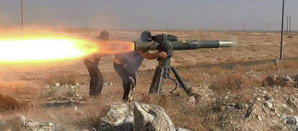 In this picture released on June 26, 2015, by a website of Islamic State militants, Islamic State militants fire an anti-tank missile in Hassakeh, northeast Syria In this picture released on June 26, 2015, by a website of Islamic State militants, Islamic State militants fire an anti-tank missile in Hassakeh, northeast Syria - Sputnik International